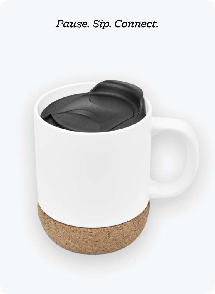 A coffee cup with a spoon in it.
